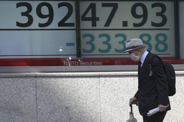 Stock market today: Asian shares are mixed, taking hot US 
